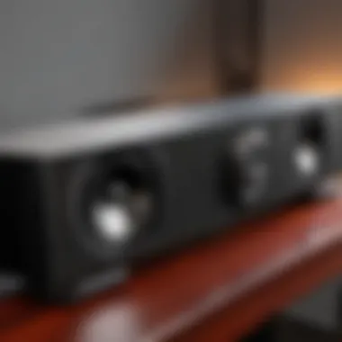 A side-by-side comparison of a soundbar and speakers, highlighting their design differences